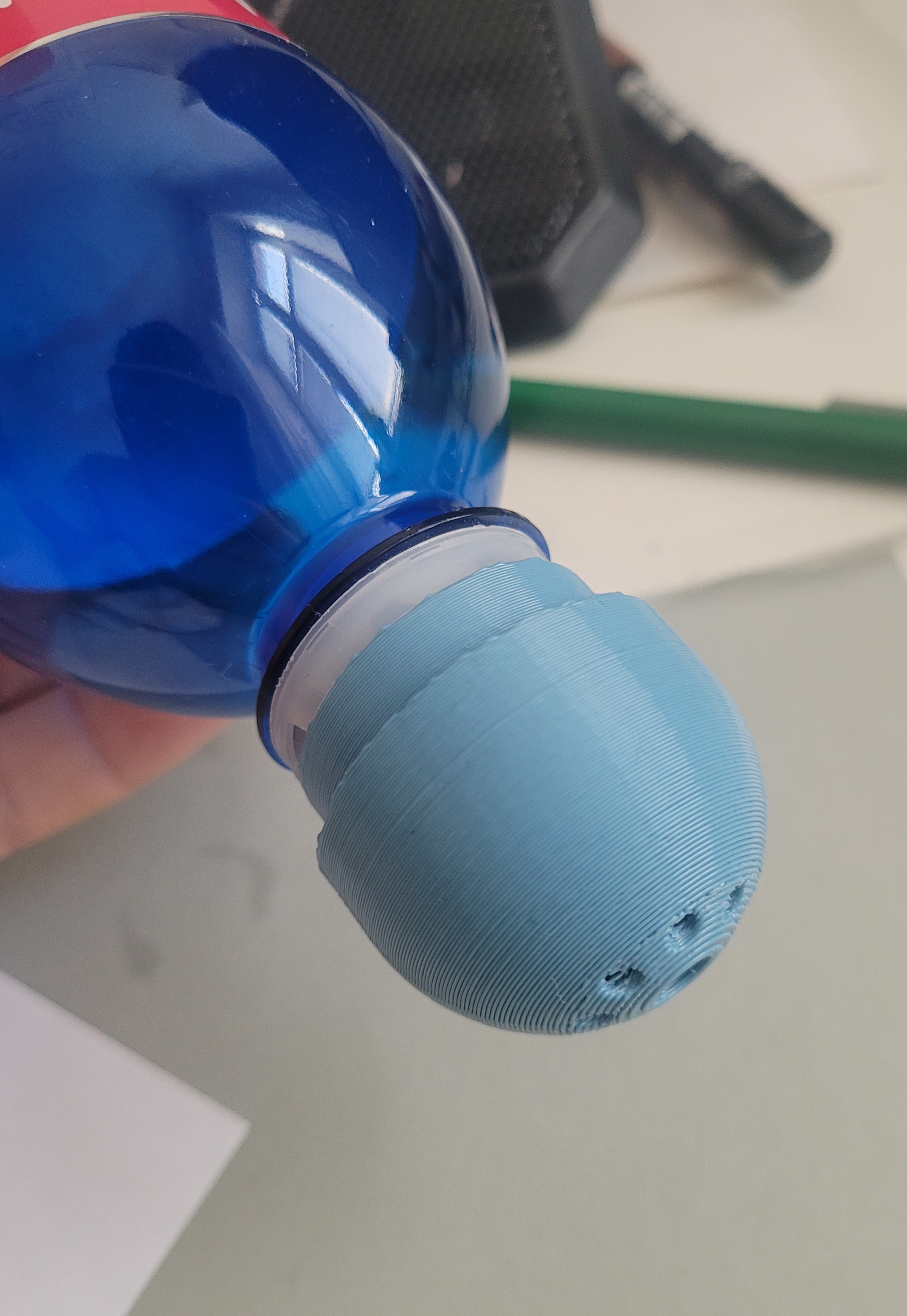 3d printed prototype on a bottle